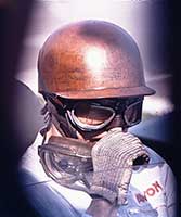 Tony Brooks in period helmet.